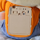 Removing Teddy Ruxpin’s vest reveals a battery door hidden on his back, as well as power and Bluetooth switches.